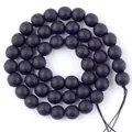 Macro detail showing faceted matte texture of black stone beads for DIY jewelry. - 10mm / Faceted Matte Black Stone