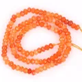 Nahaufnahme von 3x4mm facettierten orangefarbenen Karneol-Achatperlen für DIY - 3x4mm (Ca. 105 Stück/Strang) / Orange Angel Jade