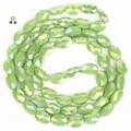 8x11mm faceted oval crystal beads in iridescent light green for DIY jewelry - 56 Pieces / Green