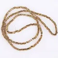 Close-up detail of 2x1mm golden flat square hematite beads for DIY jewelry making - Approx 340 Pieces/Strand / Light gold