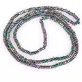 Detail of 2x1mm iridescent flat hematite beads with center hole for DIY jewelry. - Approx 340 Pieces/Strand / Colorful
