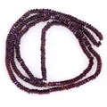 Close-up detail of 2x1mm metallic purple flat hematite disc beads for DIY jewelry making - Approx 340 Pieces/Strand / Purple