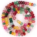 Nahaufnahme der lebendigen Farben und facettierten Texturen dieser 3x4mm Natursteinperlen. - 3x4mm (Ca. 105 Stück/Strang) / Mehrfarben-Mix