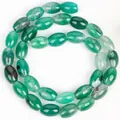 Close-up detail of green rice-shaped dragon vein agate beads for DIY jewelry - 8x12mm Approx 31 Pieces / Green Dragon Vein Agate