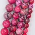 Close-up detail of magenta natural stone chalcedony beads showing marbled texture - 4mm (Approx. 88 Pieces) / Rose Red Imperial Stone