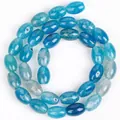 Macro detail of blue dragon vein agate rice beads showing unique internal textures. - 8x12mm Approx 31 Pieces / Light Blue Dragon Vein Agate