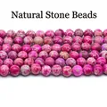 Close-up macro showing texture of magenta imperial jasper round beads for DIY jewelry - 4mm (Approx. 88 Pieces) / Rose Red Emperor Stone