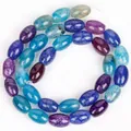 High-quality close-up of blue and purple dragon vein agate oval beads for DIY jewelry. - 8x12mm Approx 31 Pieces / Triple Color Dragon Vein Agate