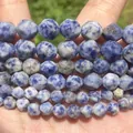 Macro detail of faceted natural blue and white stone beads with unique marble texture - 6mm Approx 58 Pieces / Faceted Blue Spot Stone