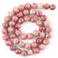 Detailed macro view of rose red natural stone chalcedony beads for DIY jewelry making. - 6mm (Approx 58 Beads) / Rose Red Rain Flower Stone