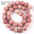 High-quality close-up detail of rose red natural stone beads with unique spotted patterns - Chrysanthemum Stone / 6mm (Approx 58 Beads) / Frosted Rose Red