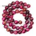 Detailed macro view of rose red natural stone loose beads for DIY jewelry making - 6mm (Approx 58 Pieces) / Type B Rose Red Tiger Eye