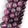 Close-up detail of rose red natural stone beads showing unique purple marbled textures - 6mm (Approx 58 Pieces) / Rose Red Flower Jade