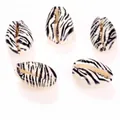 Detailed view of zebra print cowrie shell beads for DIY jewelry making accessories - 10 Pieces/Pack (16-20mm) / Zebra Pattern