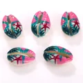 Macro view of printed cowrie shell beads featuring vibrant colorful starfish patterns - 10 Pieces/Pack (16-20mm) / Blue and Red Starfish Pattern