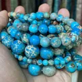 Macro view of blue natural imperial stone round beads with unique textures - 88-90 Pieces/Pack / 4mm / Lake Blue