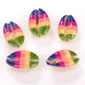 Macro detail of rainbow striped natural cowrie shell beads for DIY necklace and bracelet - 10 Pieces/Pack (16-20mm) / Horizontal Rainbow Pattern