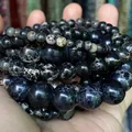 Close-up of assorted natural black Imperial Jasper stone beads in various sizes - 88-90 Pieces/Pack / 4mm / Black Imperial Stone