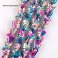 Close-up of vibrant camo butterfly turquoise stone beads for DIY jewelry making - Butterfly / 13x15mm / Light Camouflage