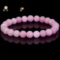 Elegant natural pink quartz gemstone beaded bracelet with a glossy black reflection - Kunzite