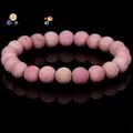Natural pink crystal beaded bracelet with smooth round stones and elegant mirror reflection - Rhodonite