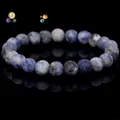 Natural blue mottled stone bead bracelet with a polished finish and elastic cord - Blue Spot Jasper