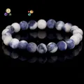 Natural blue and white sodalite stone bead bracelet with a polished reflective finish - Sodalite