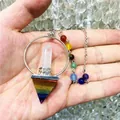 Macro detail of natural 7 chakra crystal pyramid pendant with hexagonal point - Natural / Rainbow Crystal