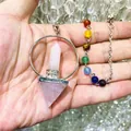 Macro detail of natural rose quartz hexagonal crystal pendant with 7 chakra beads - Natural / Rose Quartz