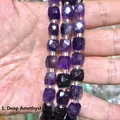 Primo piano di perle in ametista naturale sfaccettate a cubo per gioielli fai da te - 8mm / Ametista Scura