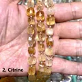 Dettaglio macro di perle di citrino naturale sfaccettate a cubetto per gioielli fai da te - 8mm / Citrino