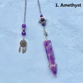 Detailed view of amethyst crystal pendulum with dreamcatcher and star charms - Amethyst Arrowhead Pendulum