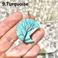 Detailed macro view of a handmade wire-wrapped turquoise moon pendant featuring a tree of life design - Turquoise