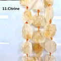 Dettaglio ravvicinato della trama di pietre grezze naturali di citrina gialla irregolare - Citrino (11) / 15 Pezzi/Confezione