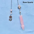 Detail view of rose quartz dowsing pendulum with Star of David and dreamcatcher charms - Rose Quartz Arrowhead Pendulum