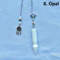 Close-up of opalite hexagonal prism pendulum with dreamcatcher and hexagram charms - Opalite Arrowhead Pendulum