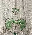Macro detail of handmade heart-shaped tree of life wall hanging with green aventurine - Green Aventurine
