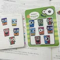 Vue détaillée d'autocollants monstre en PET sur planche et appliqués sur un carnet - Yeux de Tailles Différentes / 160 Pièces/Pack