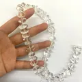 Primer plano de cuentas de cristal de roca brasileño natural para la creación de joyería. - Ancho 9-11mm Grosor 7-10mm / Transparente