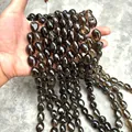 Macro shot showing the texture and transparency of natural smoky quartz irregular beads. - Irregular Tumbled Style / Approx 13X16mm / Tea Brown