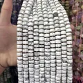 Macro detail of white marble patterned 6x10mm faceted abacus stone beads - White Turquoise / 1 Piece/Pack