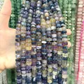 Close-up view of 6x10mm faceted multi-color natural stone abacus beads for DIY jewelry. - Fluorite / 1 Piece/Pack