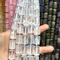 Close-up macro view of natural clear quartz cylindrical beads showing crystalline texture - 21 Beads Set / White Crystal