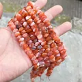 Dettaglio ravvicinato di perle di agata rossa naturale sfaccettata per gioielli fai-da-te - 58 Pezzi / Agata rossa