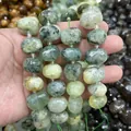 Dettaglio macro di perle in pietra di cristallo ovale sfaccettata naturale per gioielli fai-da-te - Perline Sfaccettate di Prehnite (B29) / 15x20mm (Circa 21 Pezzi)