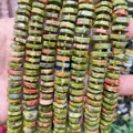 Detailed macro shot of natural Unakite stone abacus beads for DIY jewelry making projects - Faceted Abacus Beads / Approx. 73 Pieces (4x12mm) / Unakite