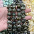 Close-up of faceted oval labradorite gemstone beads for DIY jewelry making - Labradorite Faceted Beads (B29) / 15x20mm (Approx 21 Pieces)