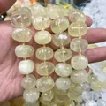 Detailed macro view of faceted oval yellow crystal beads for handmade jewelry crafts - Lemon Quartz Faceted Beads (B29) / 15x20mm (Approx 21 Pieces)