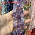Primo piano di perle in ametista naturale sfaccettata per la creazione di gioielli DIY - Ametista Chiara