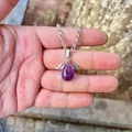 Macro view of a natural purple amethyst angel wing pendant necklace on a silver chain - Pendant Only (No Chain) / Amethyst